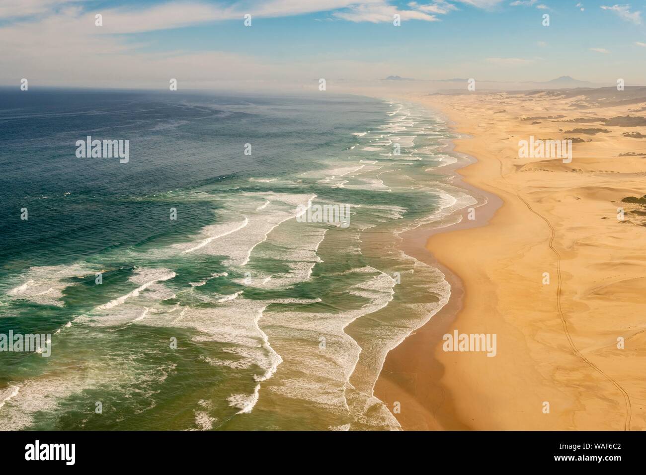 Aerial view, long coastline along sand dunes with waves, Atlantic Ocean, West Coast, South Africa Stock Photo