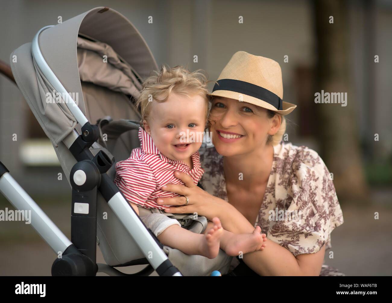 Mother with baby, 9 months, baby stroller, Baden-Wurttemberg, Germany Stock Photo