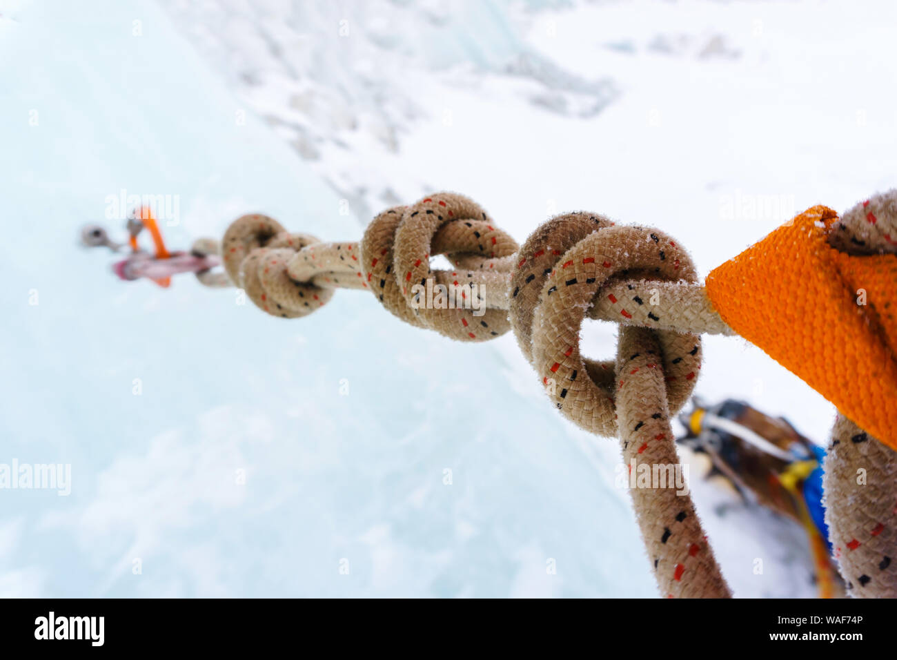 Ice climbing anchor with ice screw, carabiners and safety rope