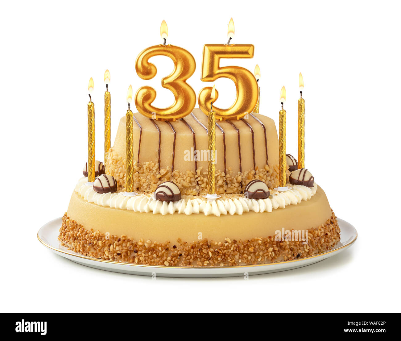 Festive cake with golden candles - Number 35 Stock Photo