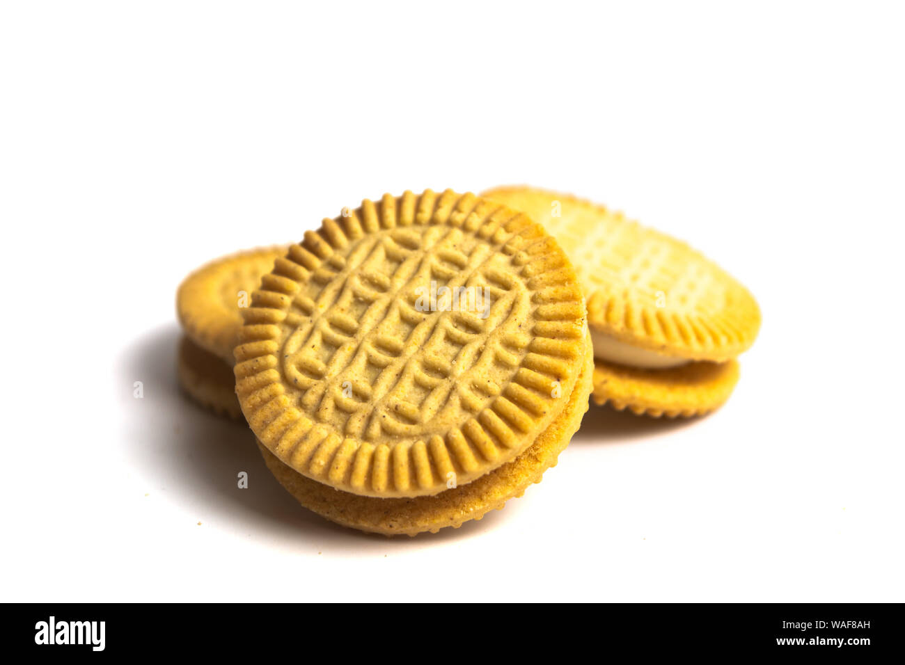Golden biscuit sweet cookies isolated on white Stock Photo Alamy