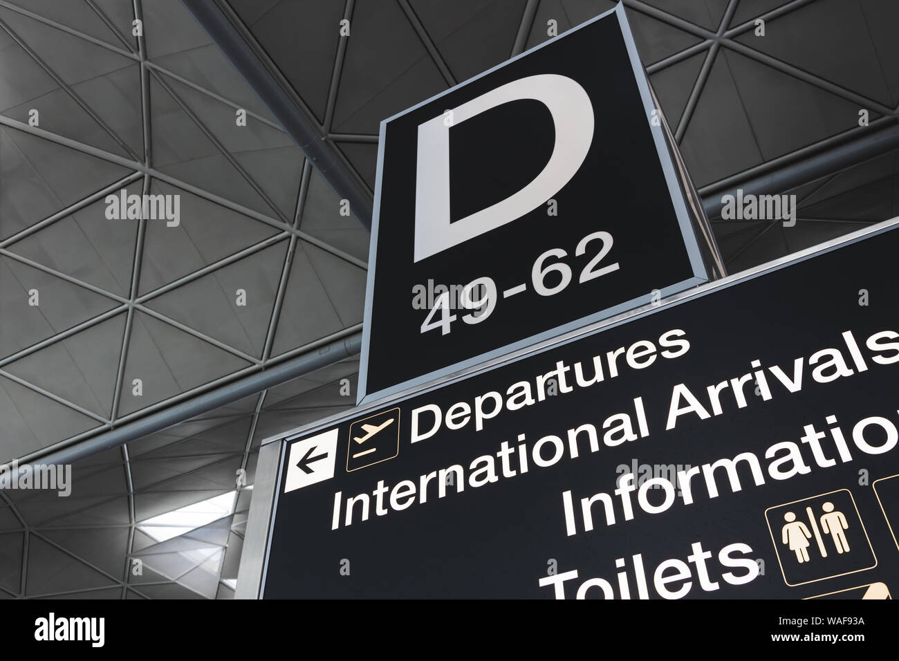 LONDON - AUGUST 7, 2019: Departures gate sign at modern airport terminal at London Stansted Stock Photo