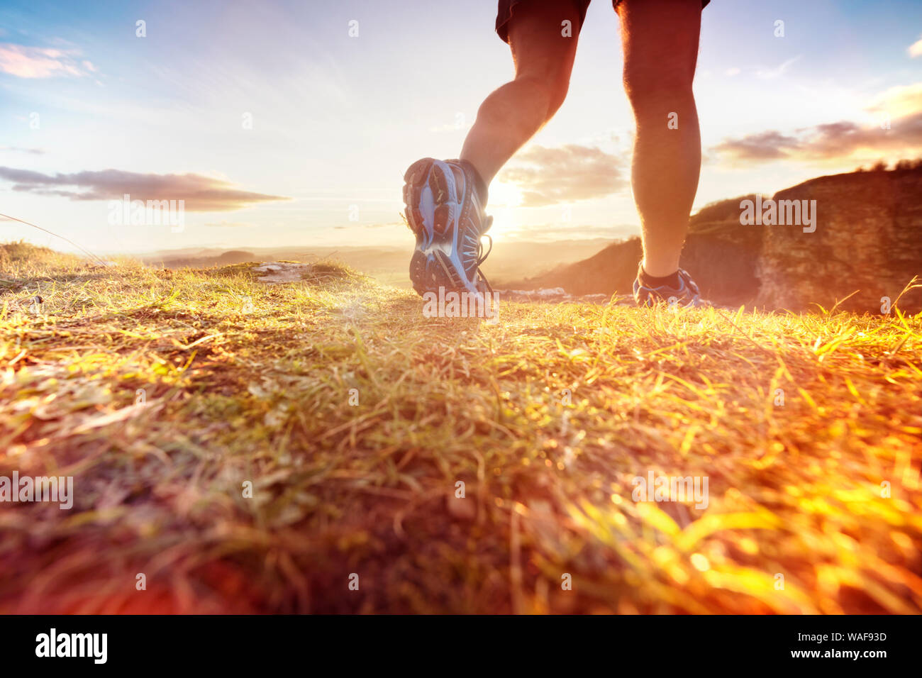 Outdoor cross-country running in morning sunrise concept for exercising, fitness and healthy lifestyle Stock Photo