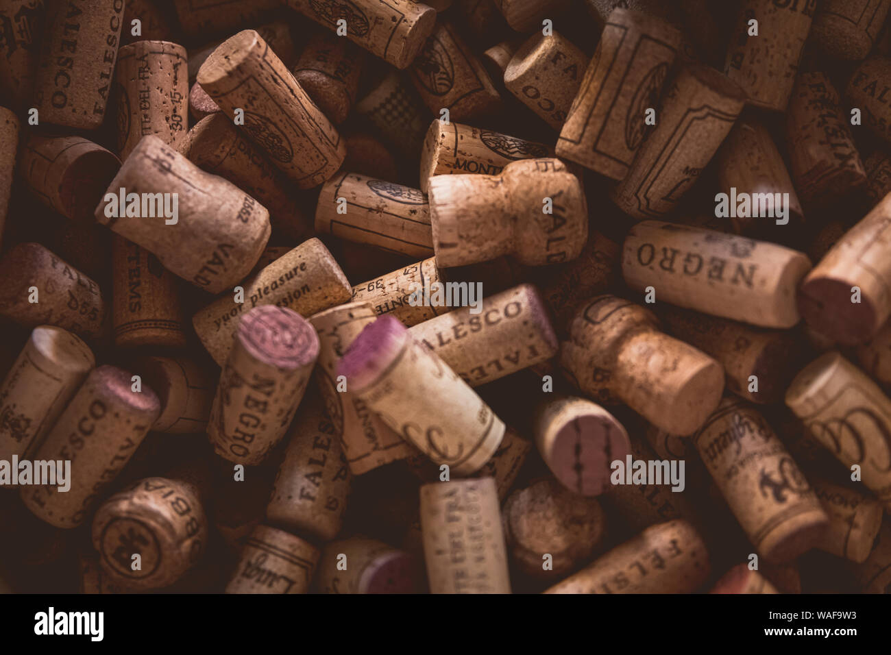 A collection of used Italian wine corks with red wine staining on some of the corks. Stock Photo