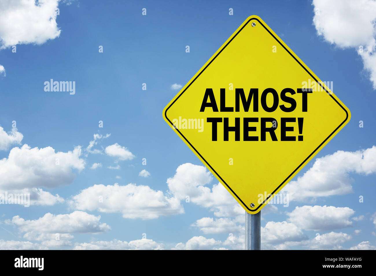 Almost there road sign concept for business motivation, encouragement and approaching a destination or goal Stock Photo