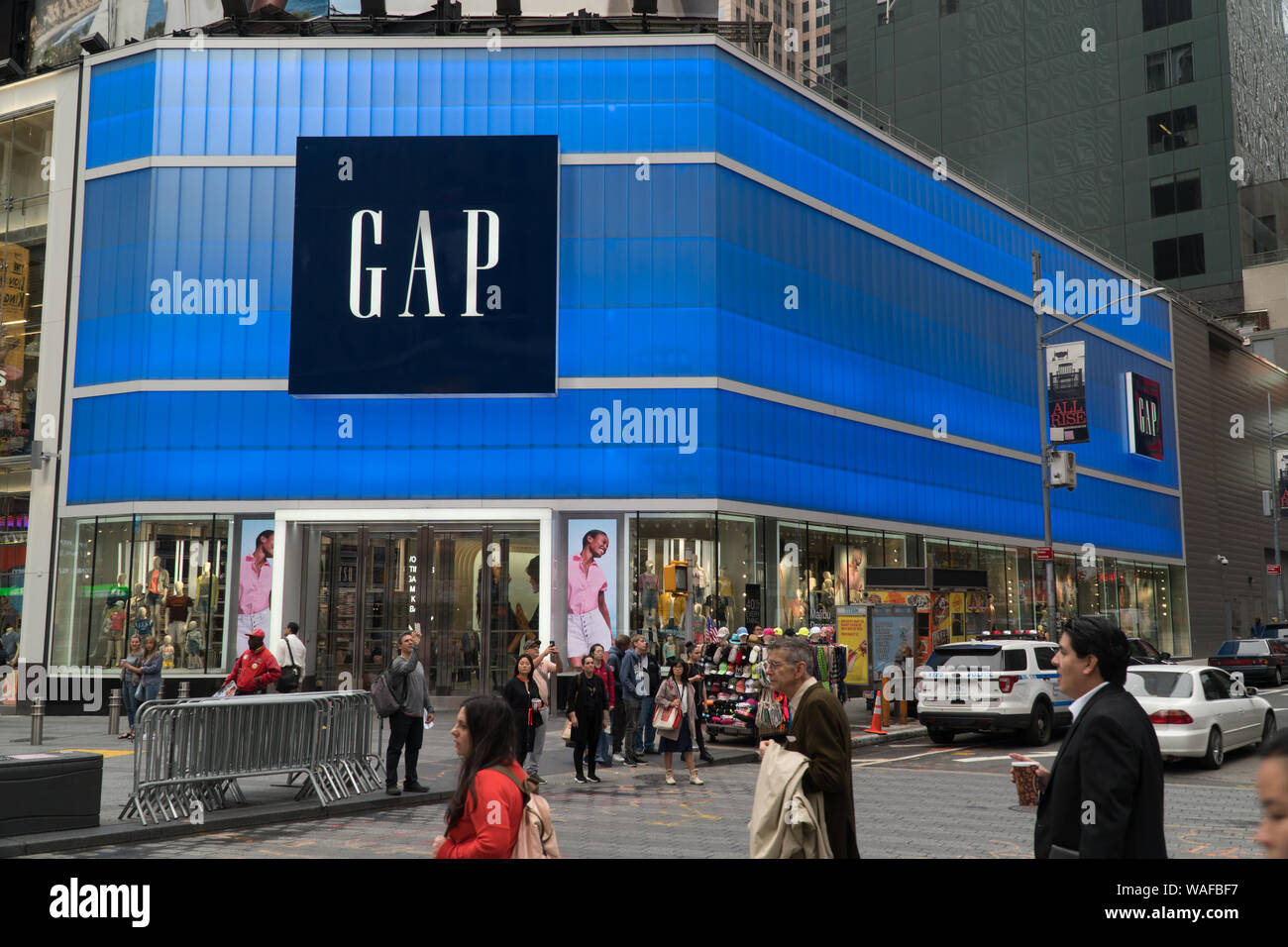 New York City, Circa 2019: GAP inc retail flagship store in Times Square manhattan. Day time exterior fashion clothing store neon sign facade Stock Photo