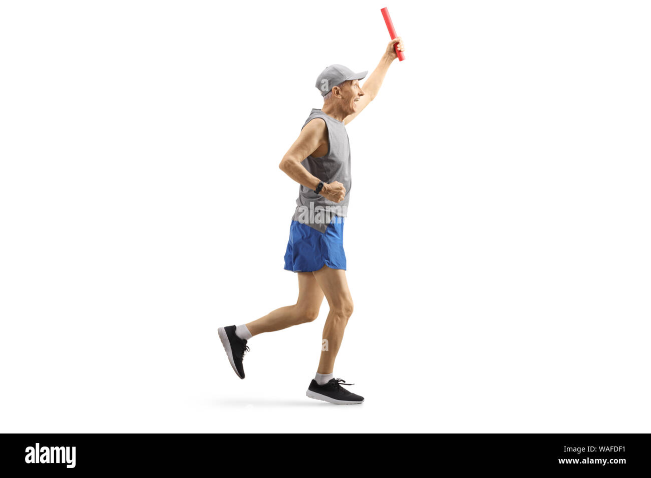 Full length profile shot of a mature man running a relay race with a baton in his hand isolated on white background Stock Photo