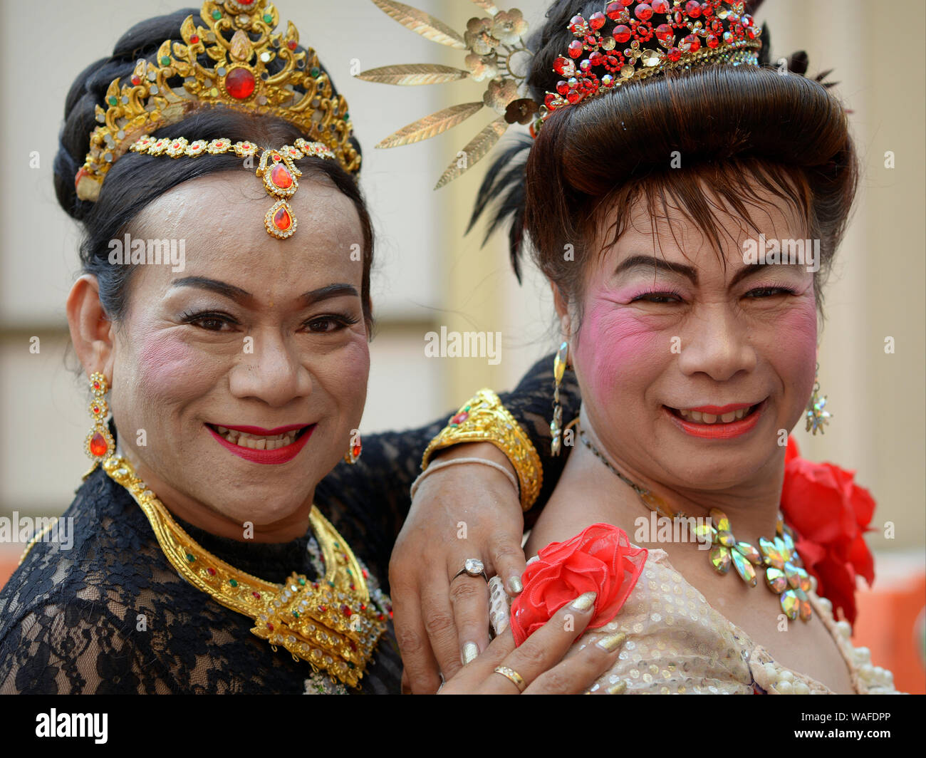 two-cross-dressing-happy-elderly-thai-kathoey-smile-for-the-camera-at-chinese-new-year-2019-ce-WAFDPP.jpg