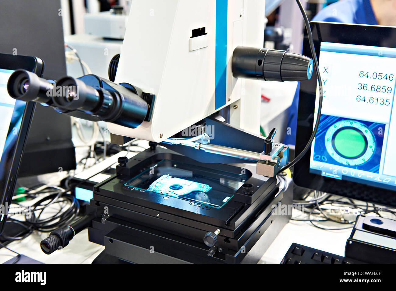 Electronic measuring microscope with monitor Stock Photo Alamy