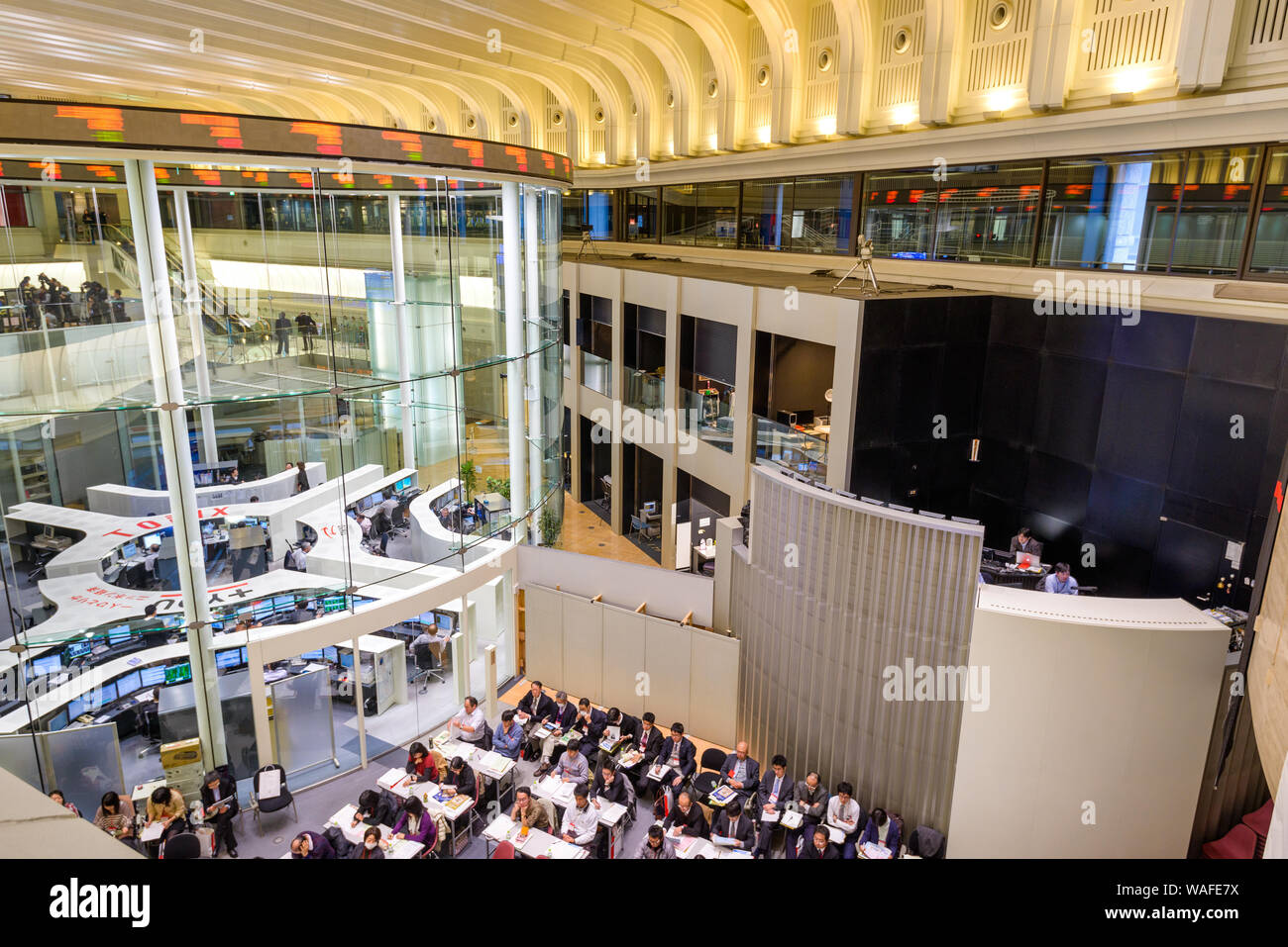 TOKYO, JAPAN - DECEMBER 28, 2012: News reporters set up inside the Tokyo Stock Exchange. It is the third largest exchange in the world. Stock Photo