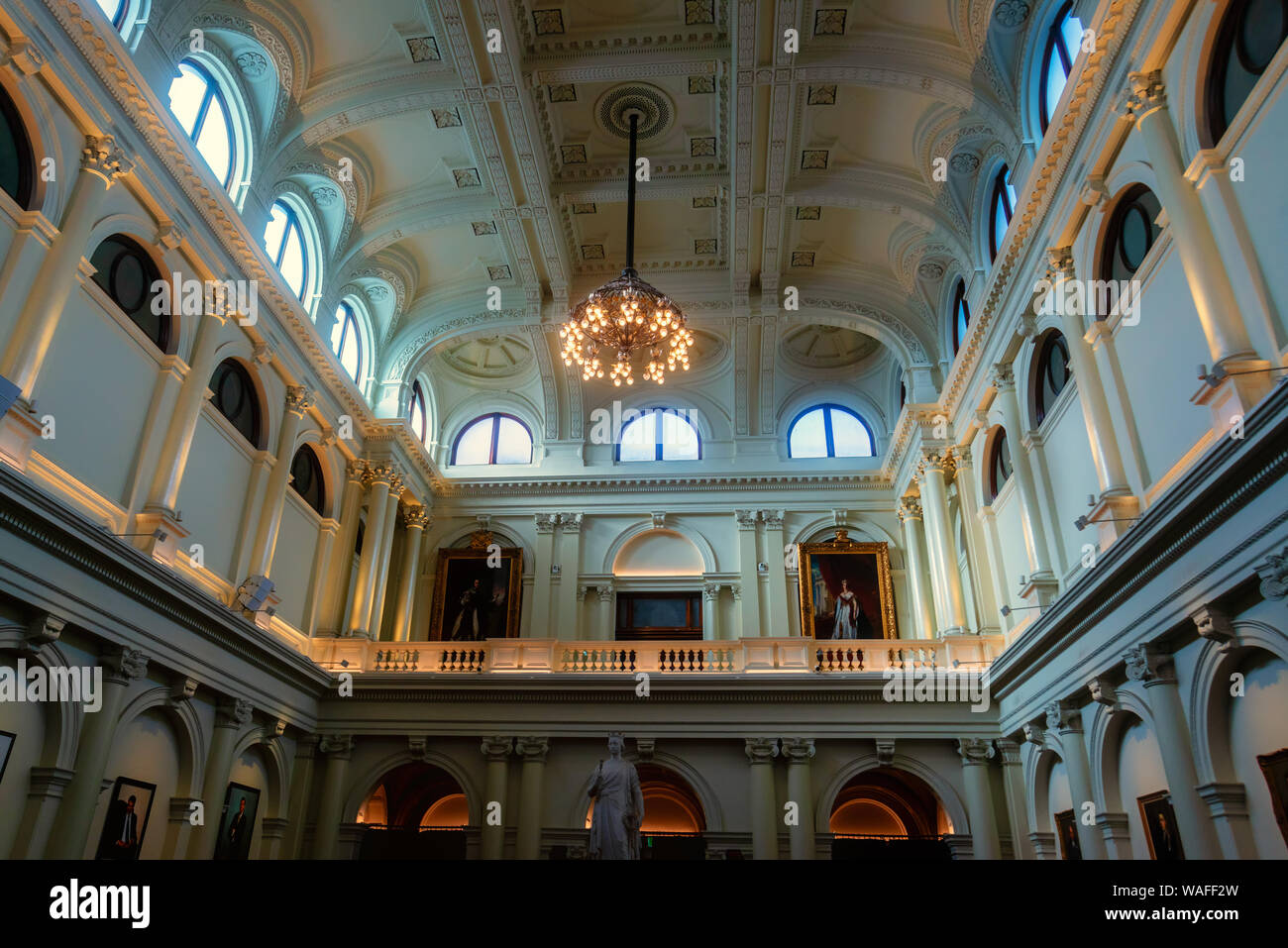 Queen's Hall in Parliament House, Melbourne, with a statue of Queen