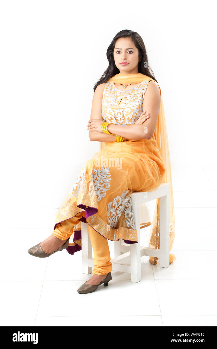 Girl sitting arms legs crossed hi-res stock photography and images - Alamy