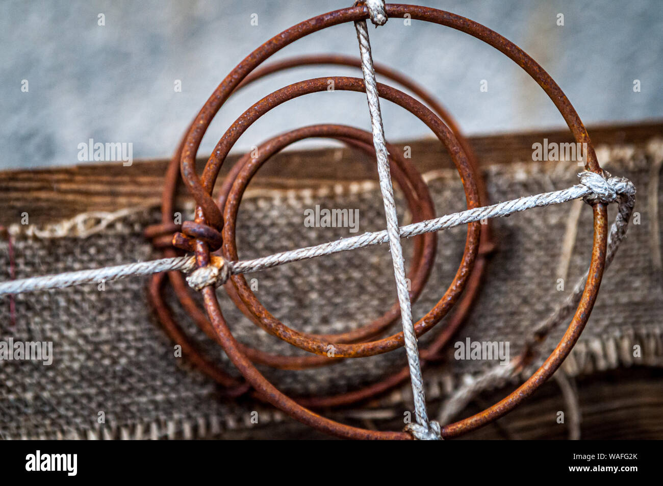 A very old exposed and worn bed spring dating to the early 20th century. Stock Photo