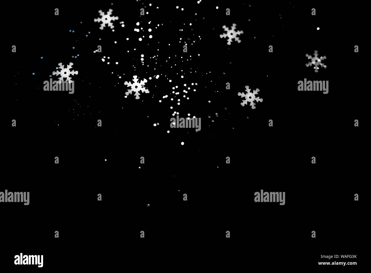 Abstract black background with isolated snowflakes Stock Photo - Alamy