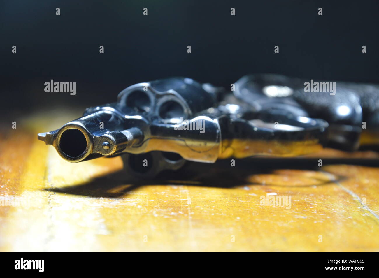 revolver gun without bullet on wooden table Stock Photo Alamy