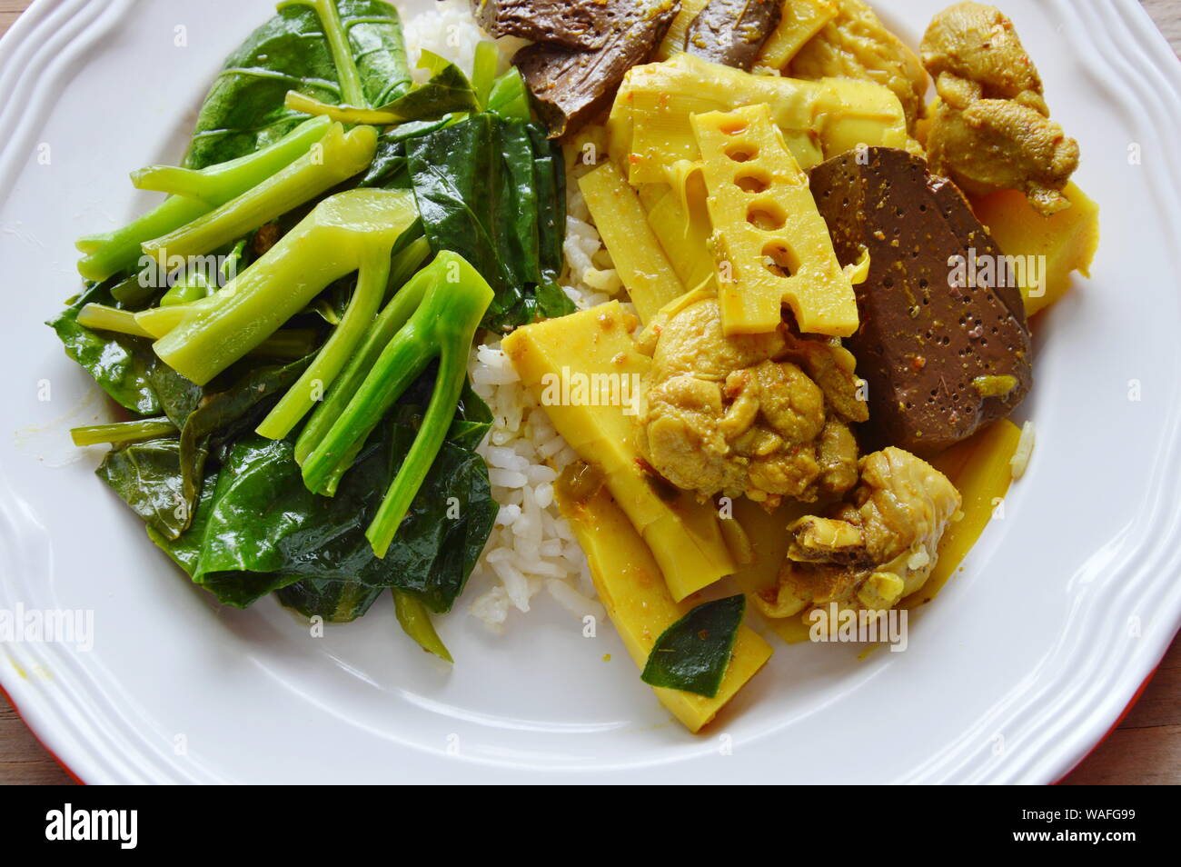 spicy chicken with bamboo shoot curry and stir fried Chinese kale on