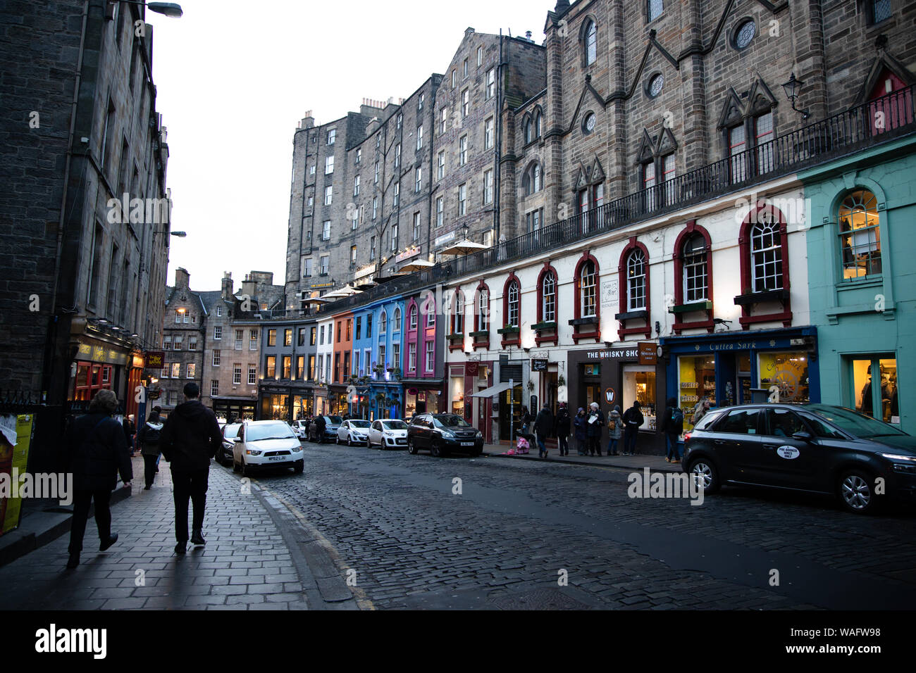 Streetview of Victoria Street with its cobbled road gentle curve and colourful shopfronts Old Town Edinburgh Scotland Stock Photo