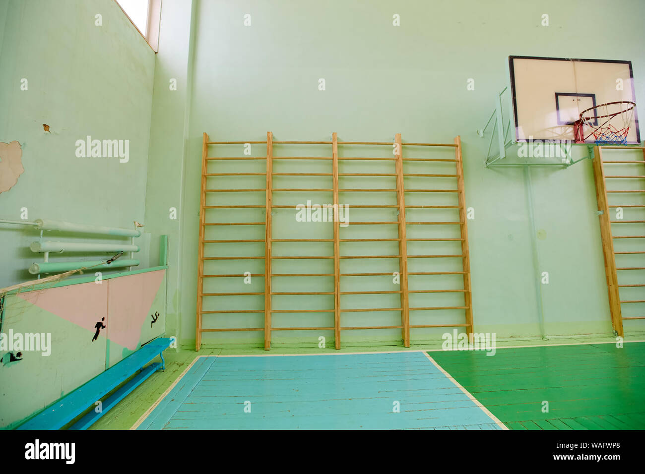 Empty gym in a school with a Swedish wall. Stock Photo