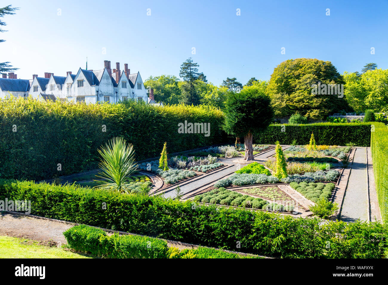 St Fagans Castle from 1580 is surrounded by a mixture of formal and informal gardens at St Fagans National Museum of Welsh History, Cardiff, Wales, UK Stock Photo