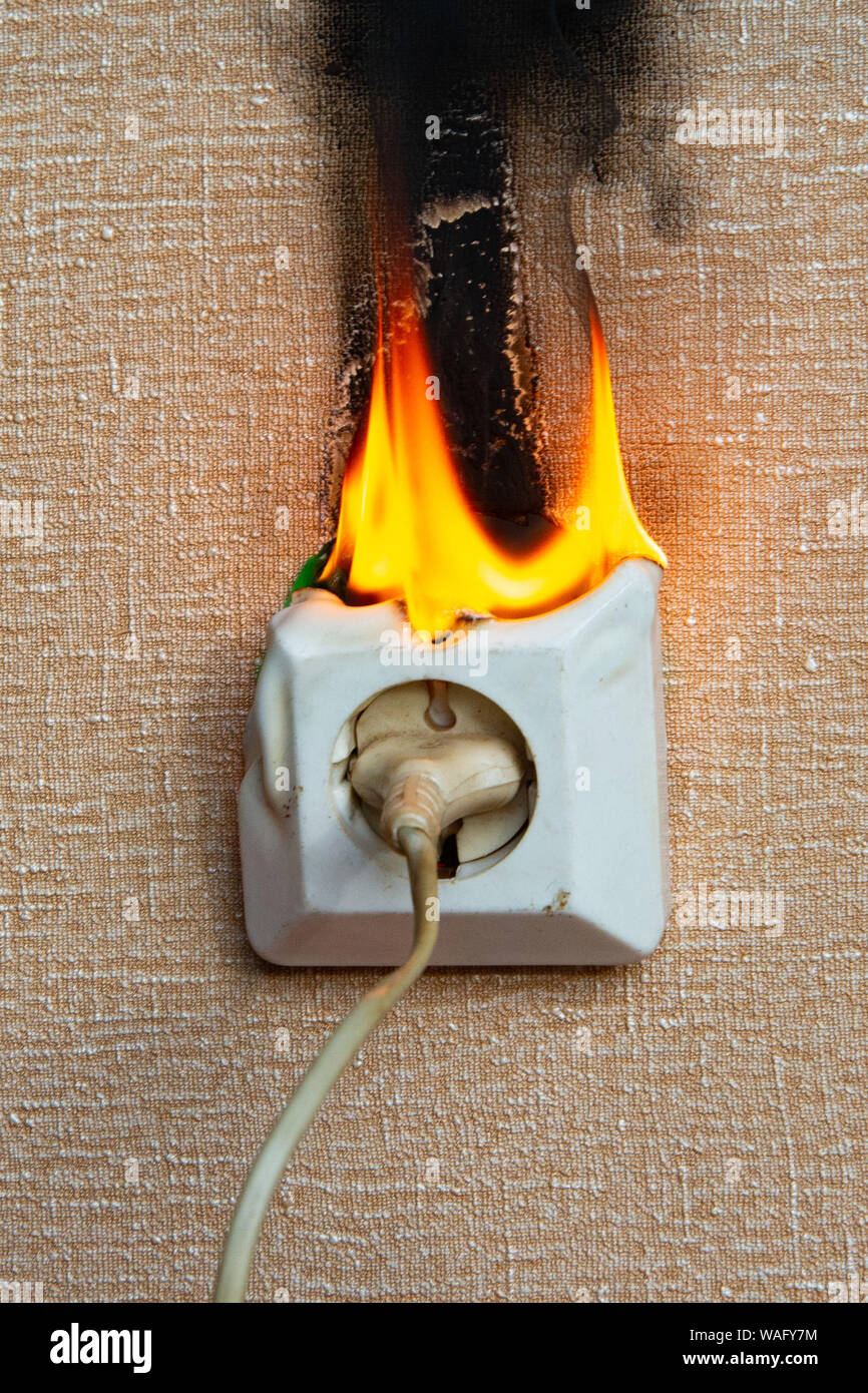 Burning electrical wiring and electrical outlet. Faulty wiring causes