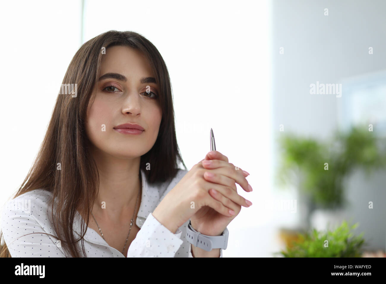 Cute woman holding pencil Stock Photo