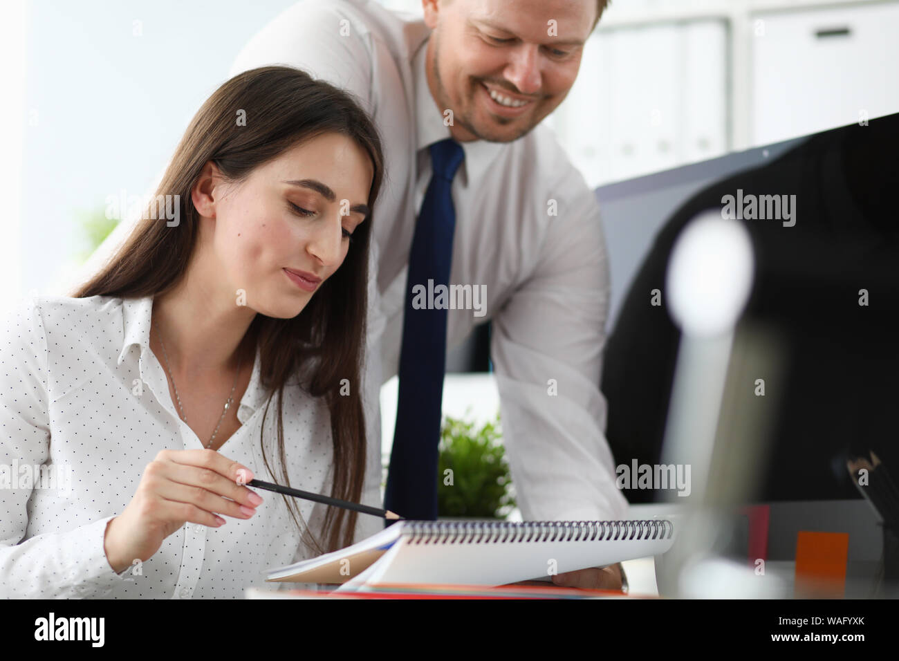 Businesswoman discussing design with customer Stock Photo