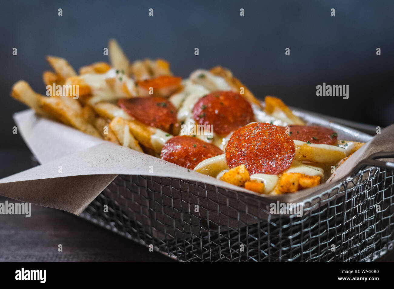Pizza Fries made from Fries, smokey pepperoni, threecheese sauce and