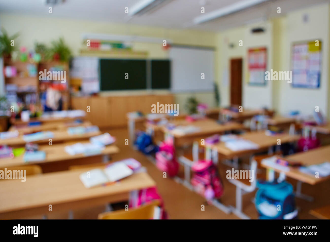 Classroom in a blurred background with no children. Students left their  backpacks and notebooks and went on a break Stock Photo - Alamy