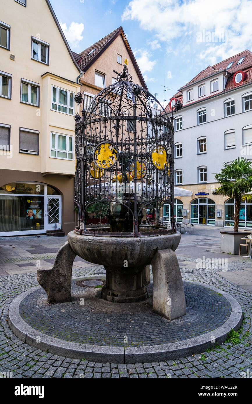 Stuttgart, Germany, August 15, 2019, Famous fountain of lucky hans called hans im glueck brunnen at cobblestone square in downtown restaurant district Stock Photo