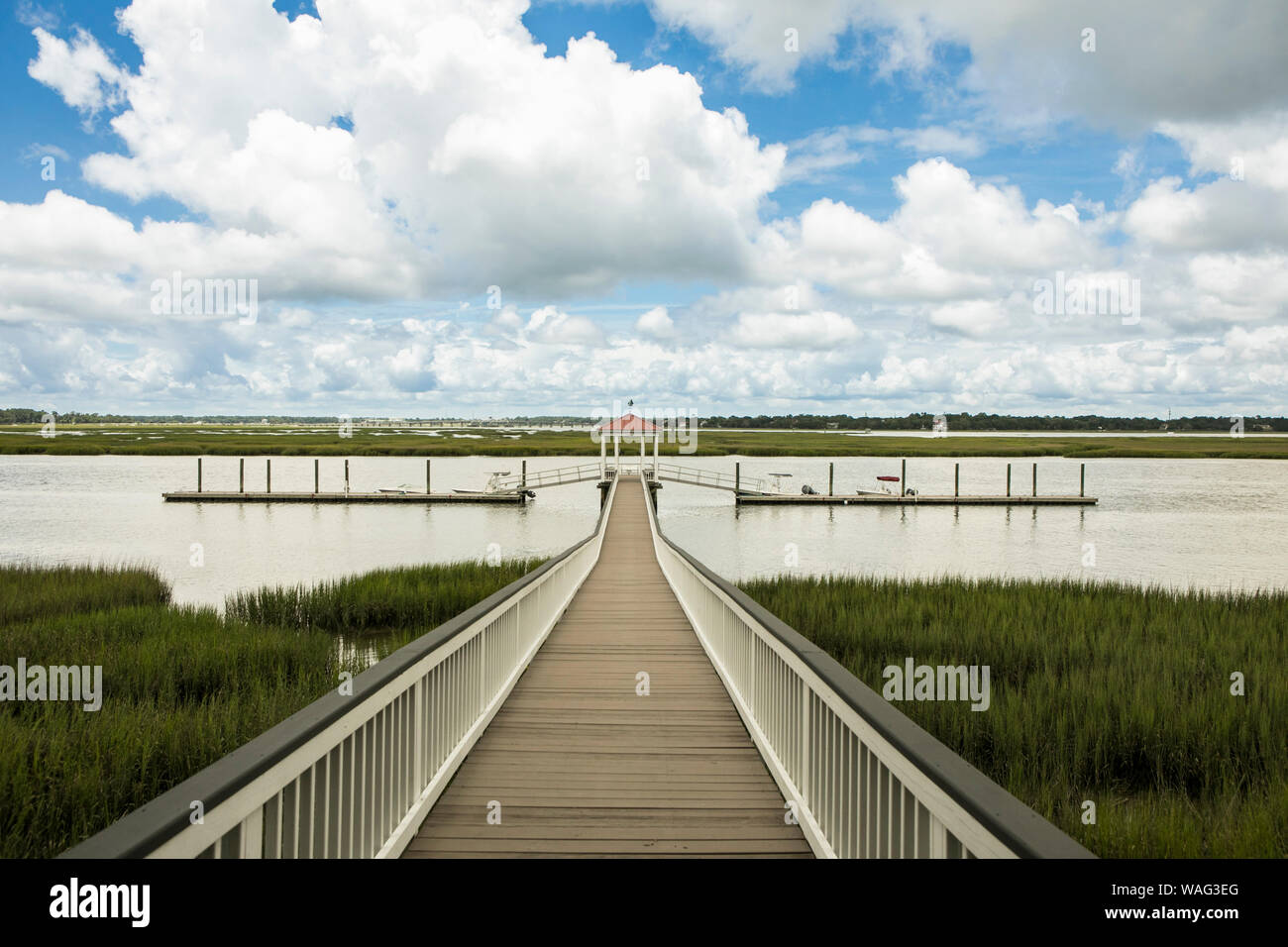 Symmetrical dock with boats on the river in Beaufort, South Carolina. Stock Photo