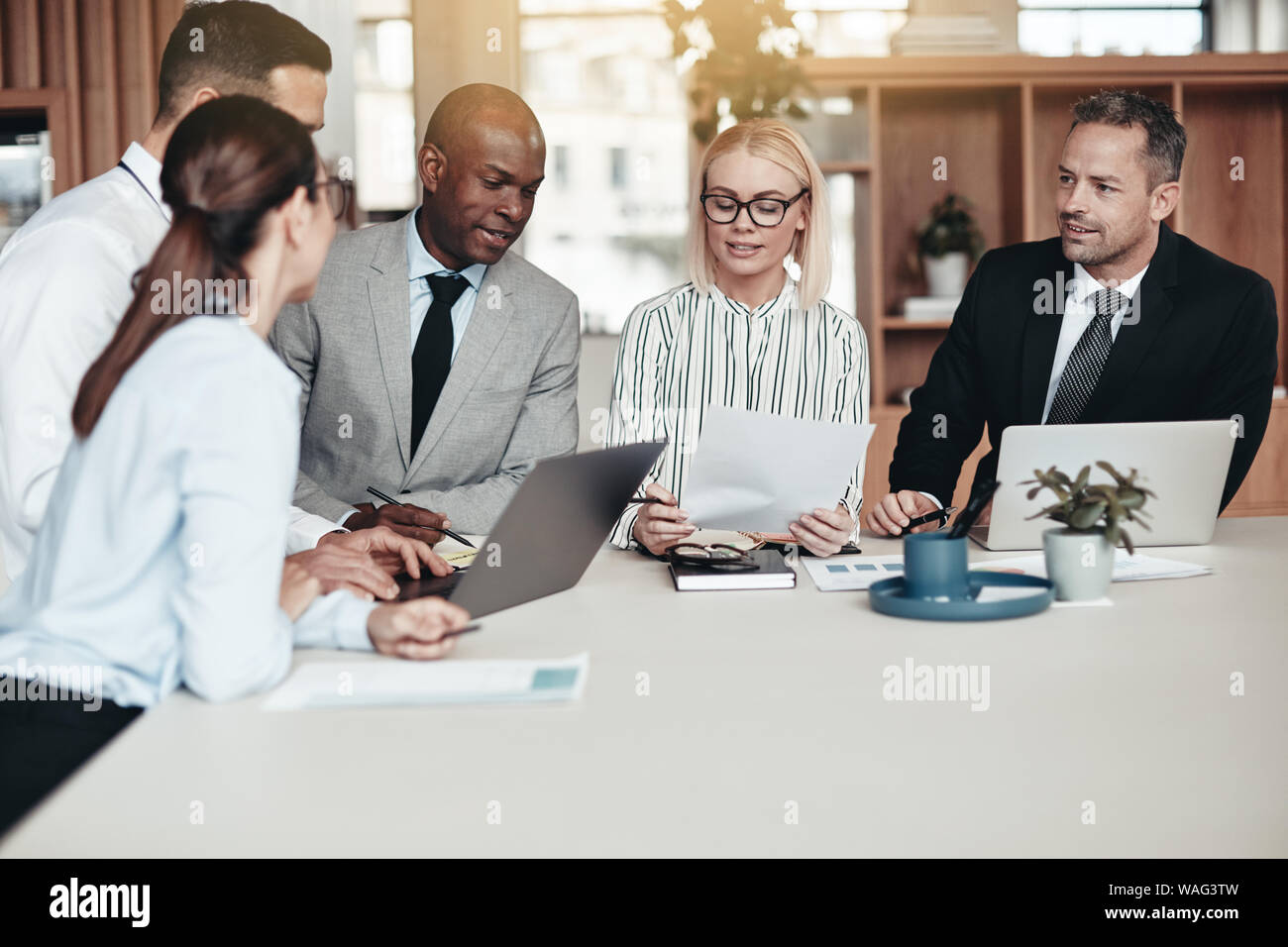 Working laptops table modern office hi-res stock photography and images ...