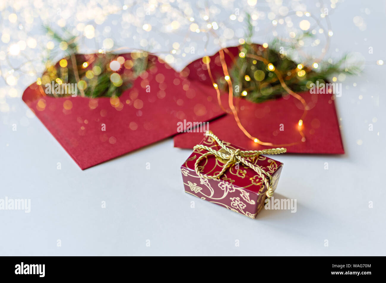 Two red envelopes with fir branches. New Year's gift. Selective focus. Stock Photo