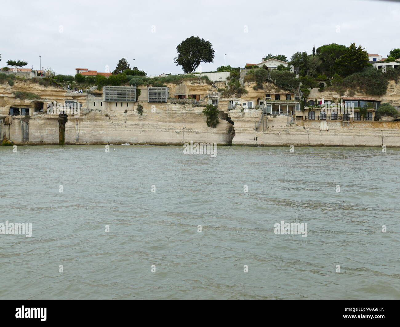 Crutse in the Gironde estuary to see the troglodyte caves in the cliffs of Meschers Stock Photo