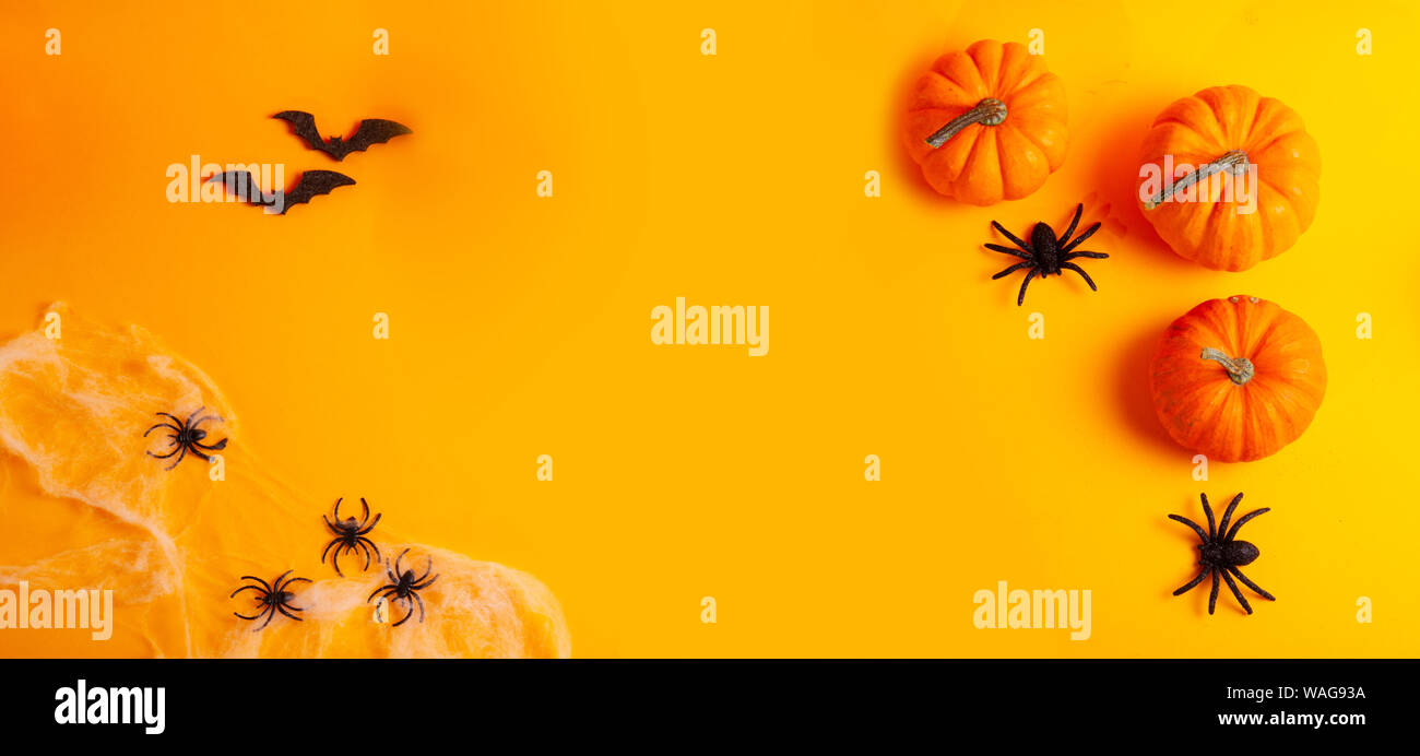 Halloween scene on orange background Stock Photo - Alamy