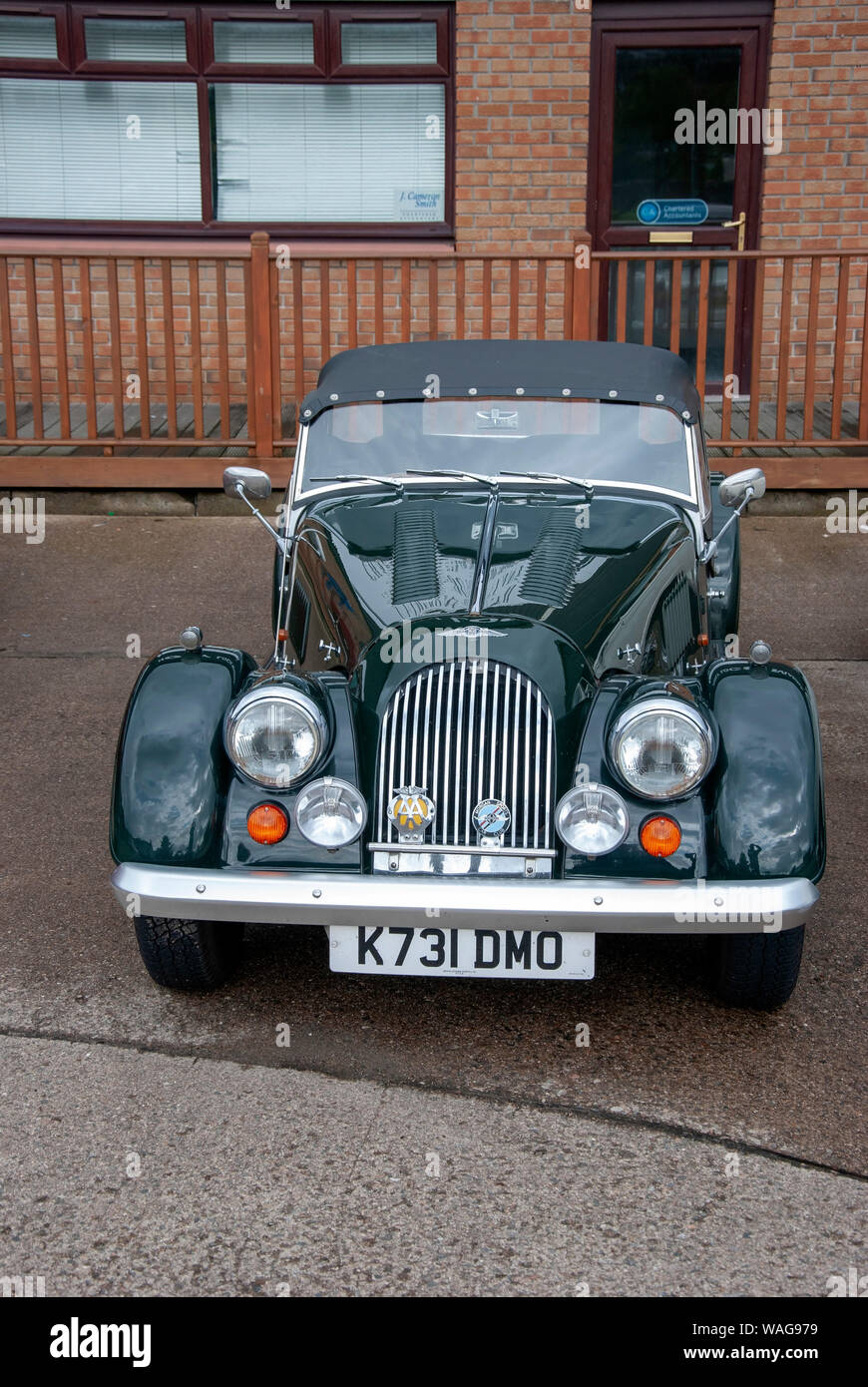 1993 British Racing Green Morgan 4/4 Tourer Classic Luxury Convertible Sports Car Black Hood front portrait view parked Holy Loch Marina nobody Stock Photo
