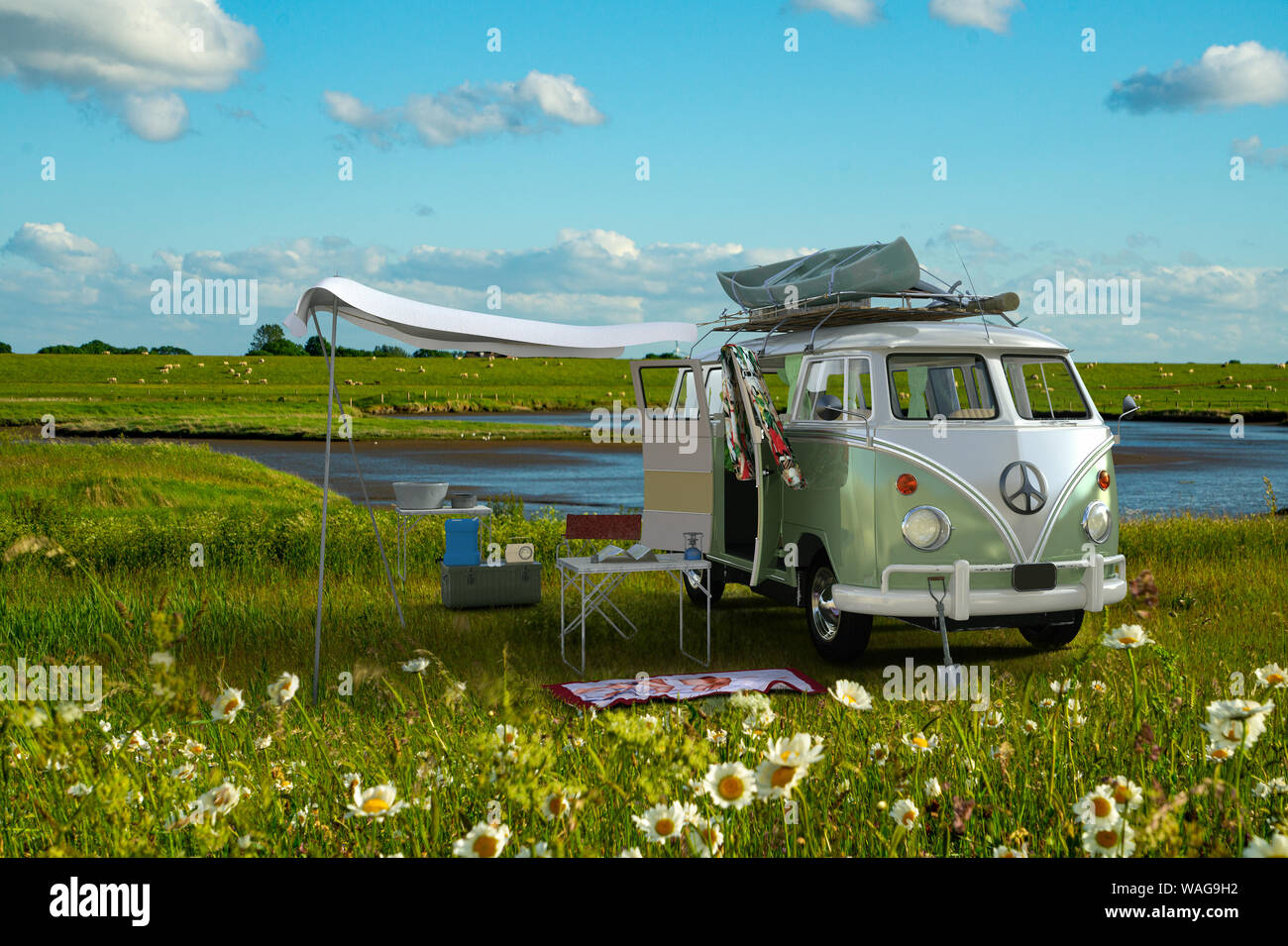 Road Trip, a classic VW camper van parked behind a Wadden sea dike in North Germany Stock Photo