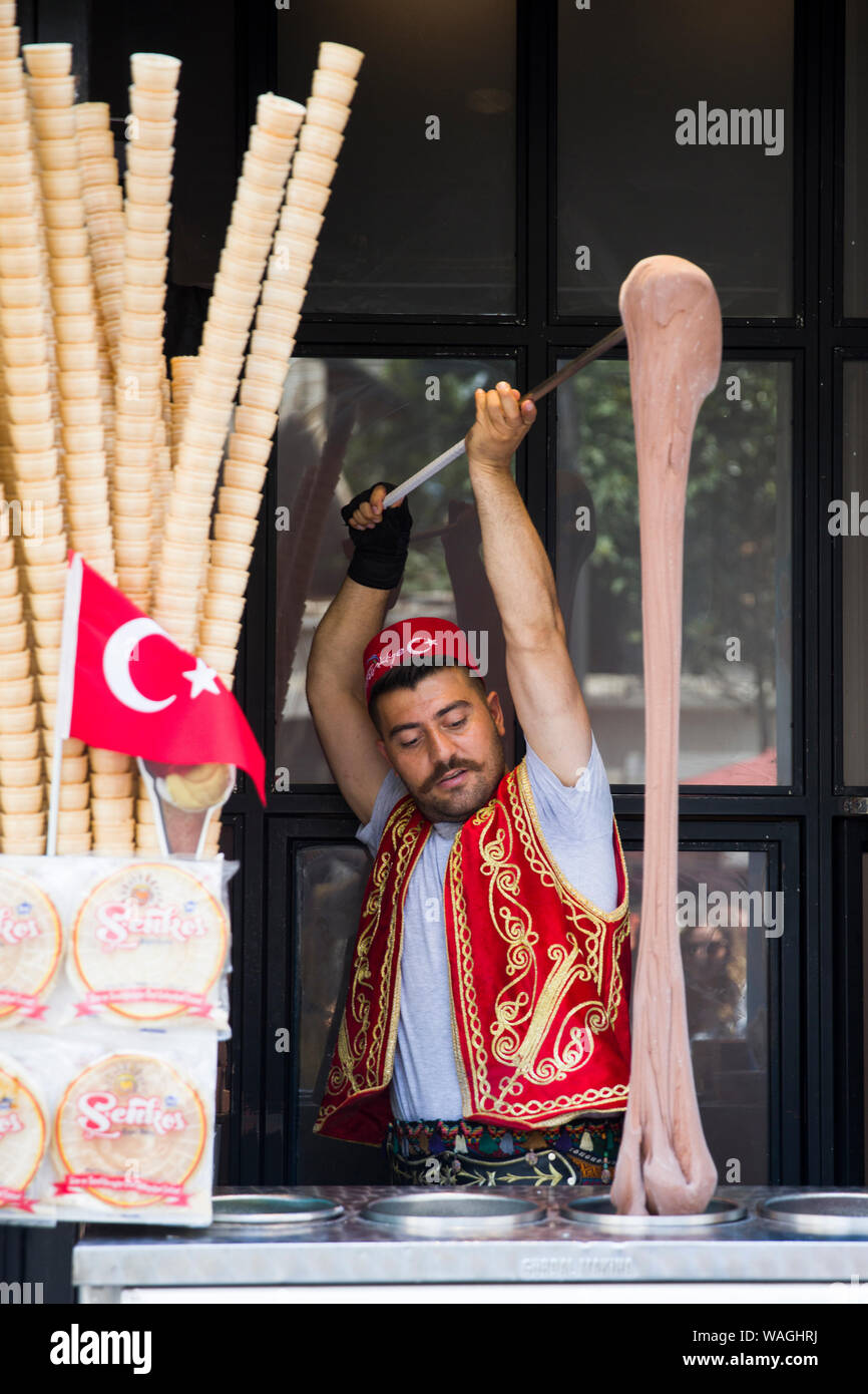 ISTANBUL, TURKEY - JUNE 15, 2019: Unidentified seller of Turkish ice cream at Istanbul, Turkey. Traditional Turkish ice cream was made with salep, pro Stock Photo