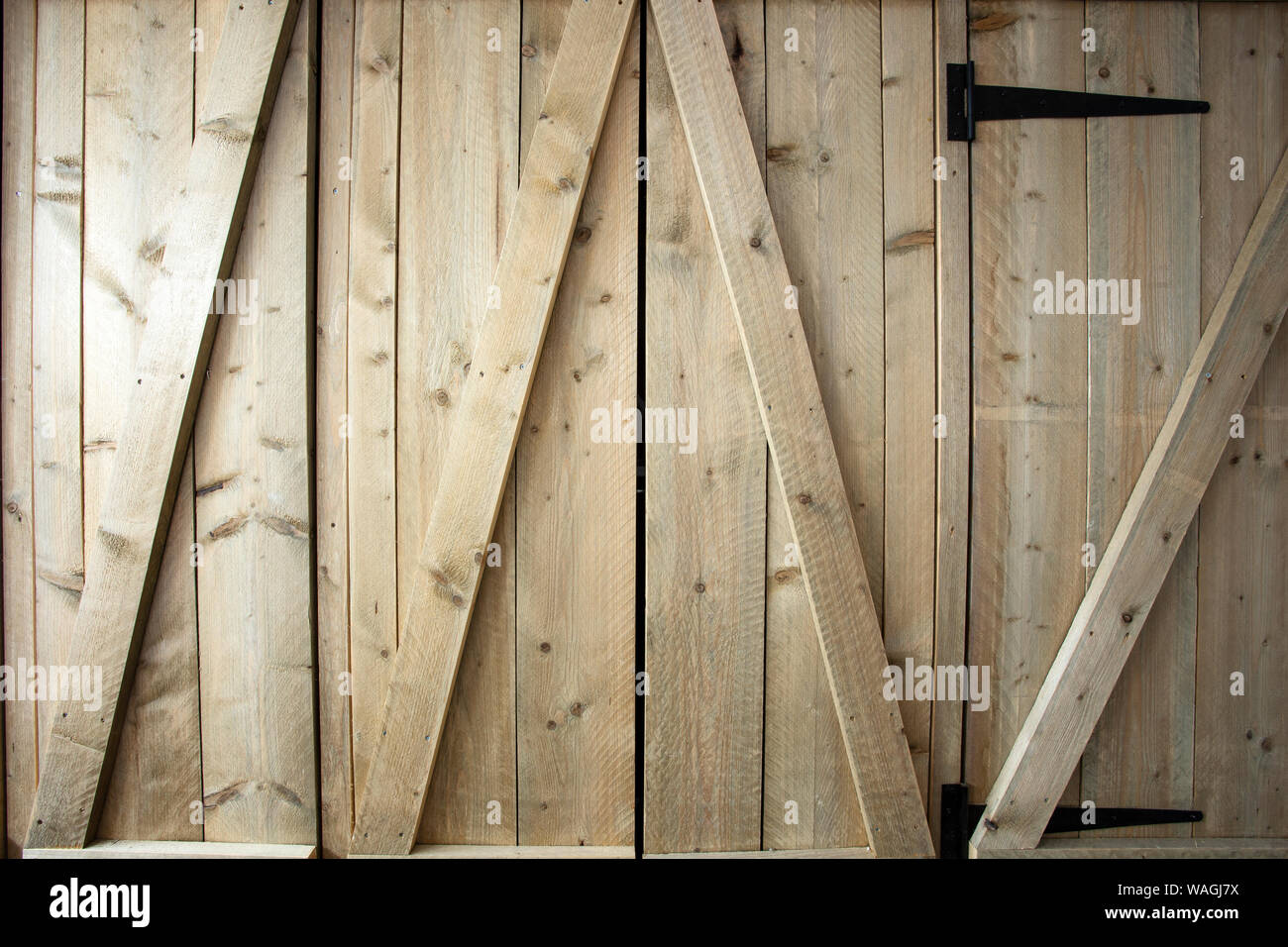 Traditional wooden barn doors detail of farm house doors, closeup