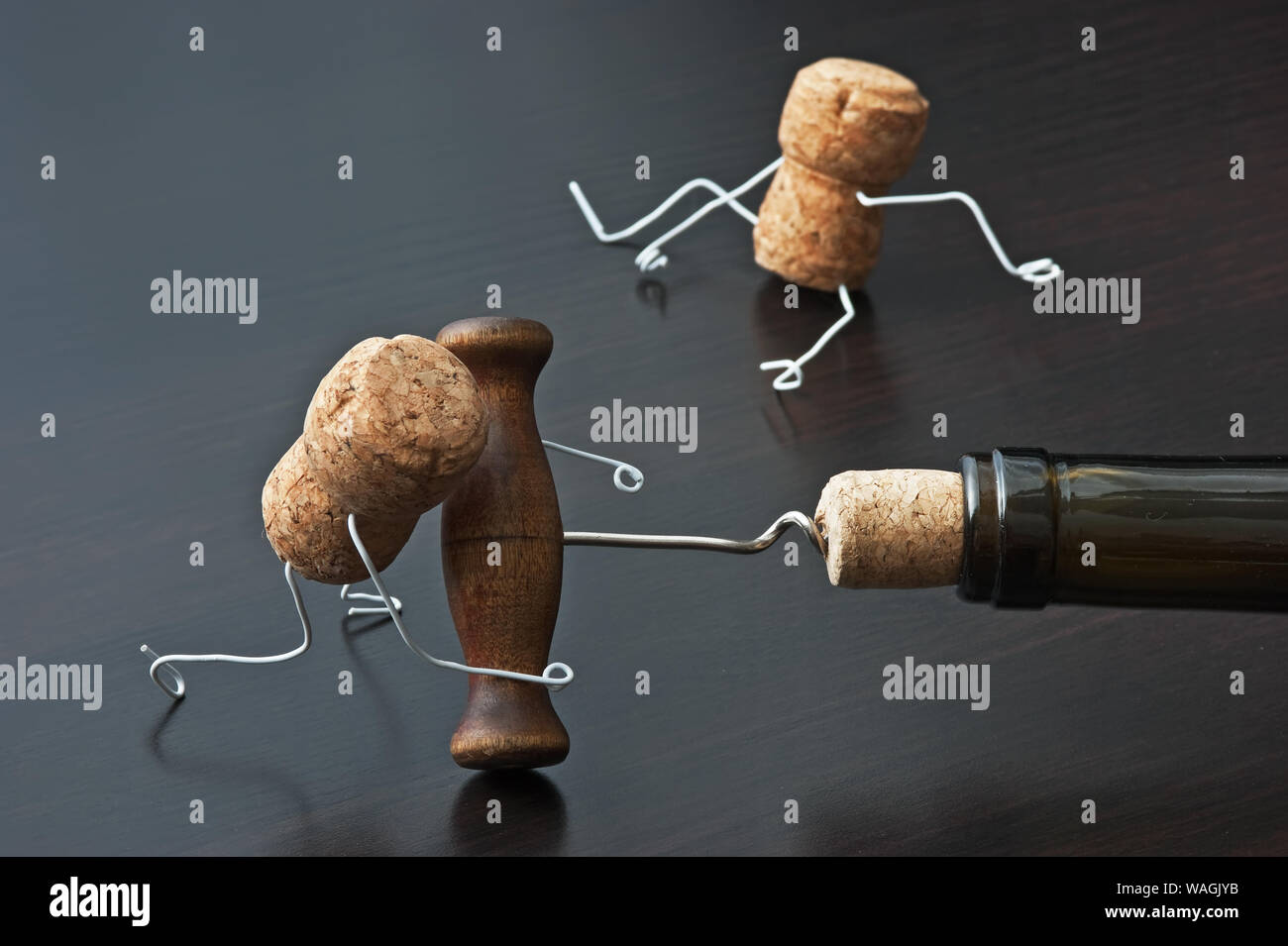 two wine corks and bottle with corkscrew Stock Photo Alamy