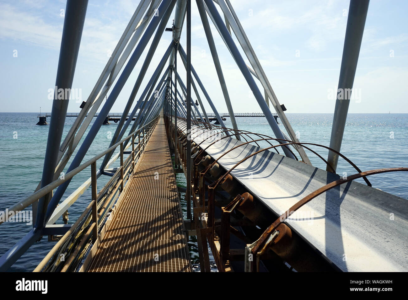 Long conveyor on the coast of Denmark Stock Photo