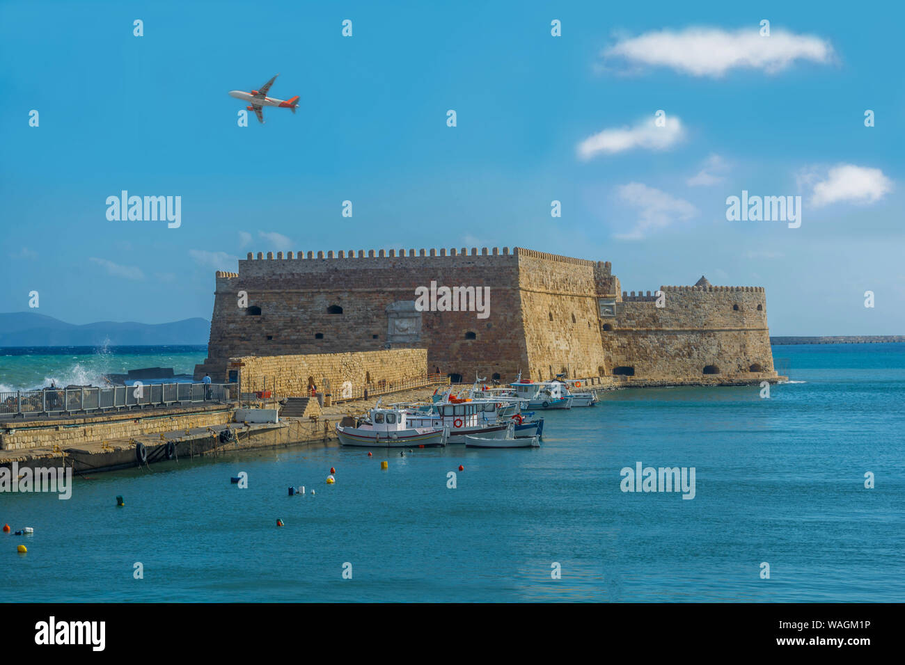 Heraklion harbor with old Venetian fort Koules. Nice blue sky and clouds. Κούλες or Castello a Mare is a fortress. Stock Photo