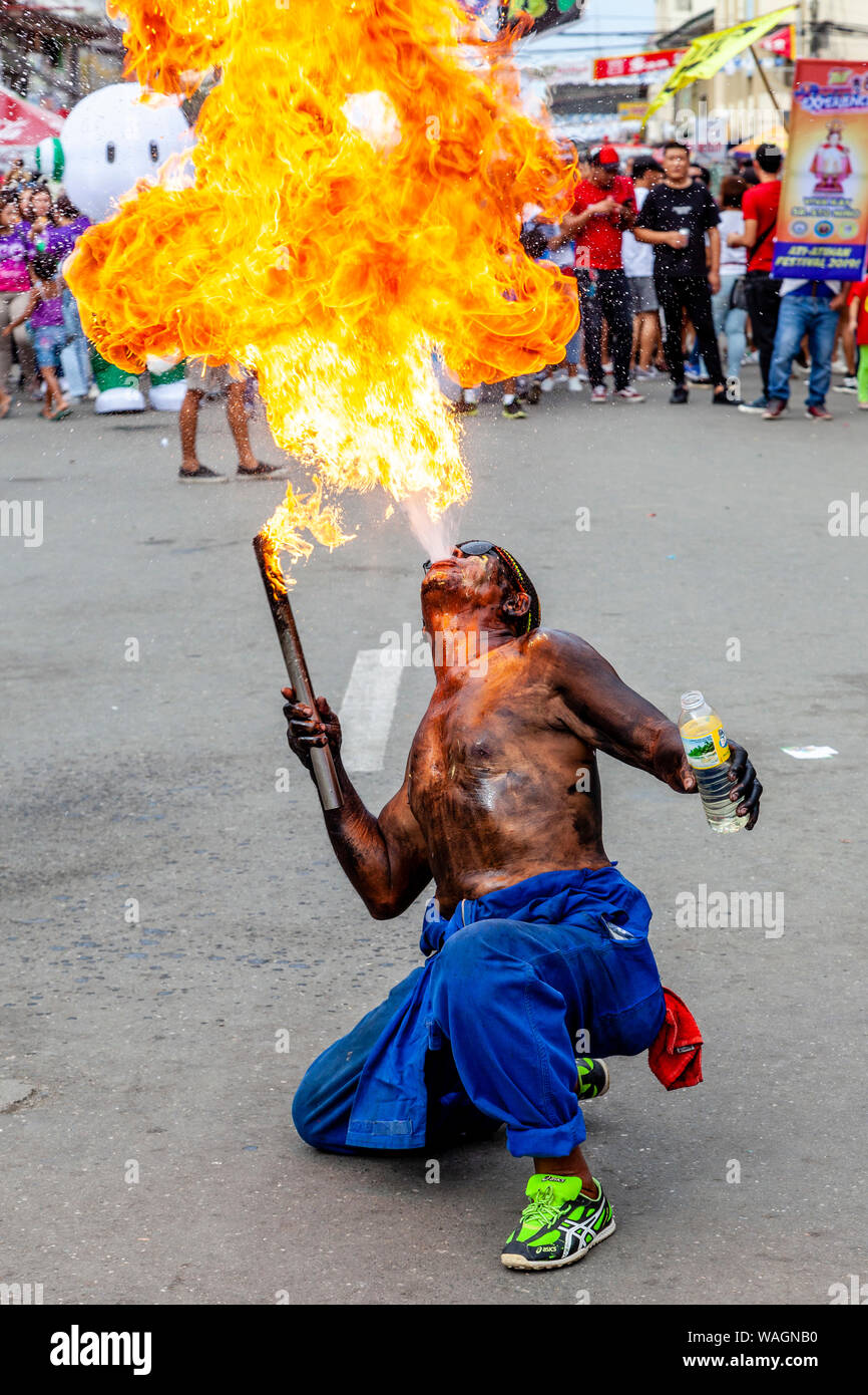 A Fire Breather Performs In The Street During The Ati-Atihan Festival, Kalibo, Panay Island, Aklan Province, The Philippines. Stock Photo