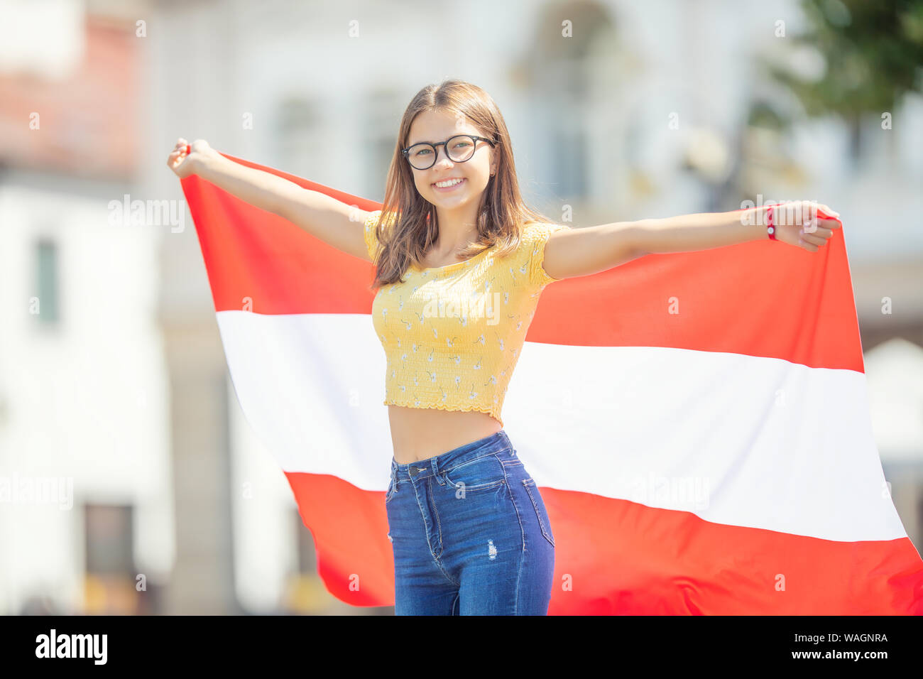 Attractive happy young girl with the Austria flag Stock Photo Alamy