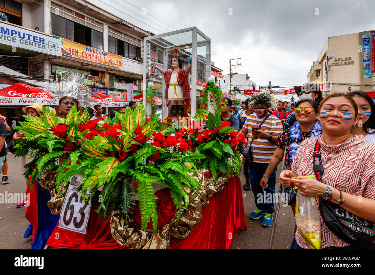 A Procession Of Floats With Santo Nino Statues Take Part In A Street Procession During The Ati
