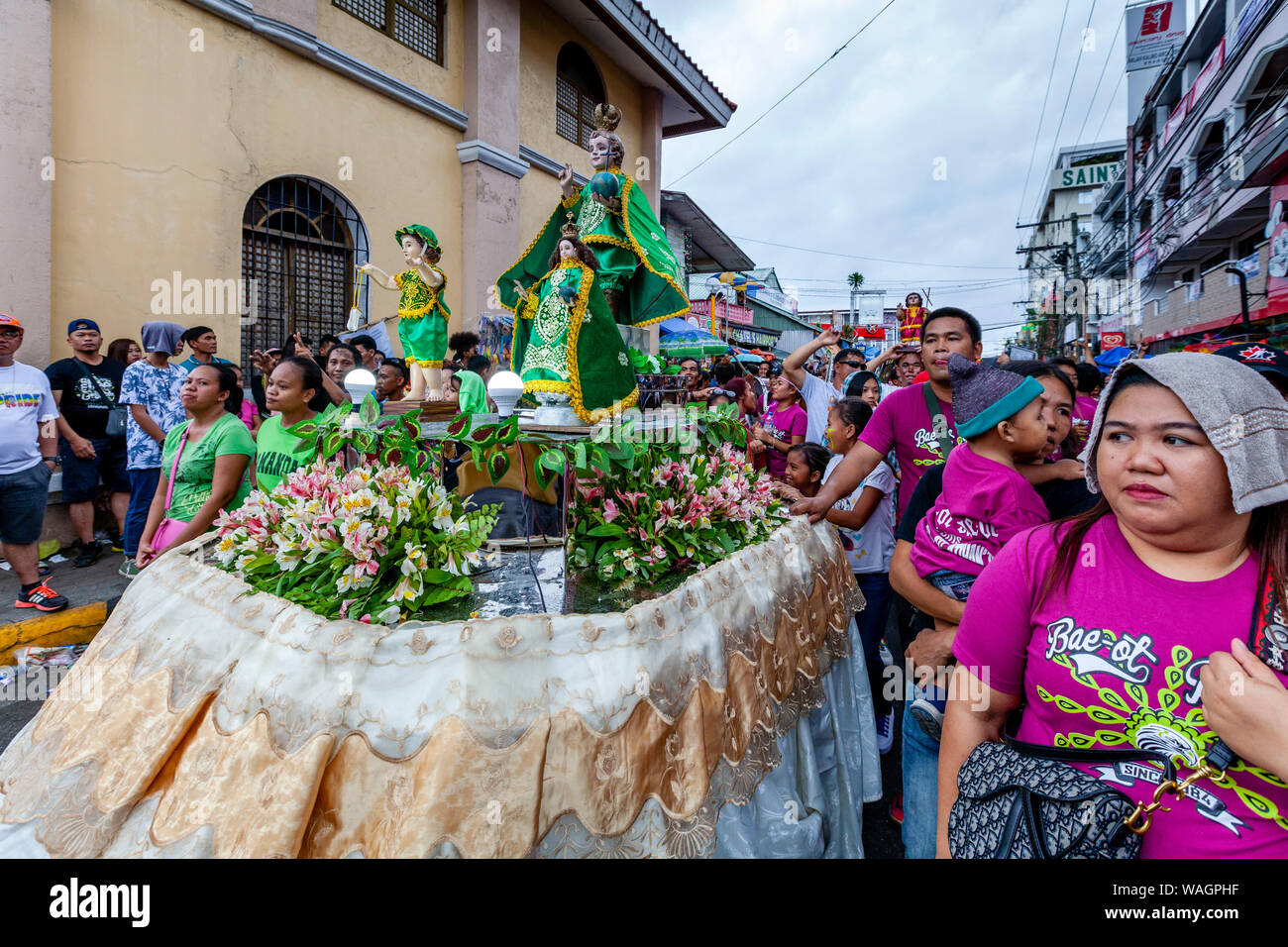 A Procession Of Floats With Santo Nino Statues Take Part In A Street