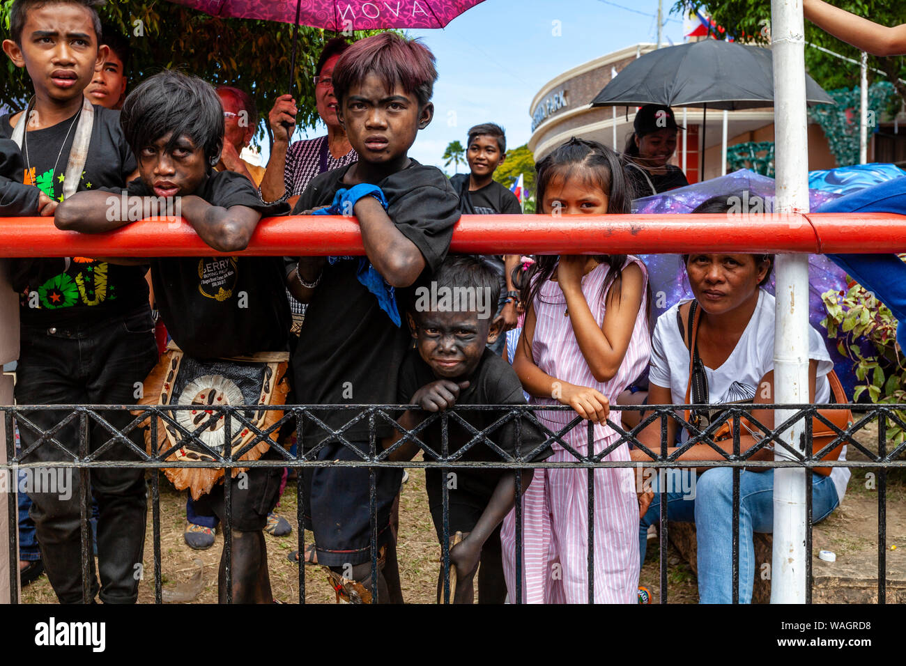 Filipinos Watch A Passing Procession During The Ati-Atihan Festival, Kalibo, Panay Island, Aklan Province, The Philippines. Stock Photo