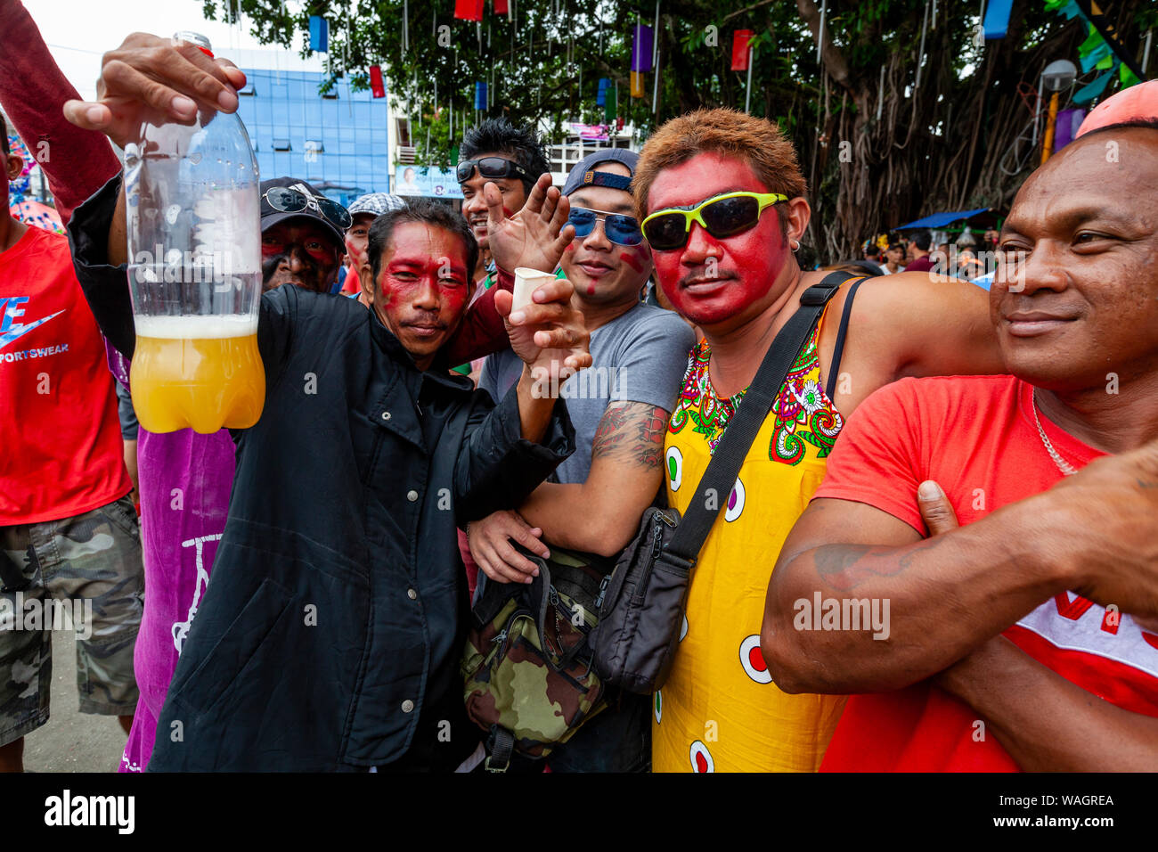Local People Drinking Alcohol At The AtiAtihan Festival, Kalibo, Panay