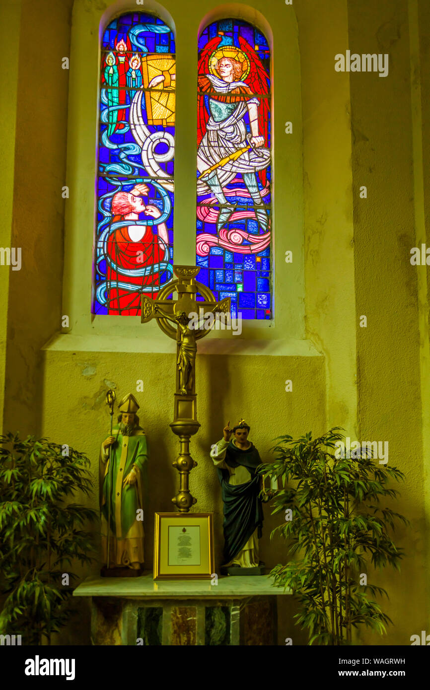 Interior of St Patricks Catholic Church with 3 bay stained glass window by Ireland's most famous stained glass artist, Harry Clarke' 1889-1931 .in New Stock Photo