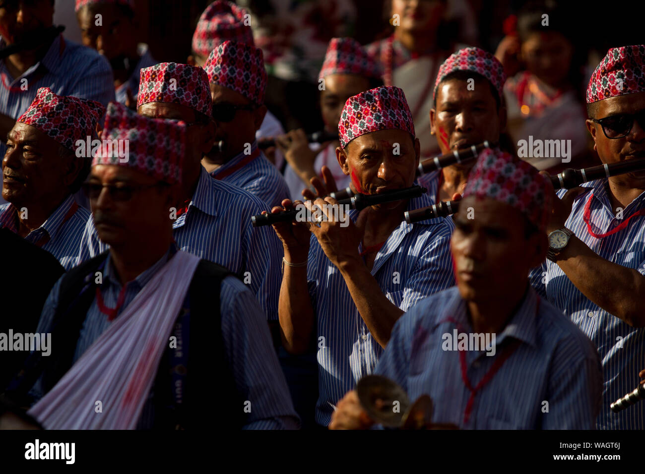 Lalitpur, Nepal. 20th Aug, 2019. Men from ethnic Newar community in traditional attire play the flute during Ganesh Puja Festival at Patan Durbar Square in Lalitpur, Nepal, Aug. 20, 2019. Credit: Sulav Shrestha/Xinhua Stock Photo