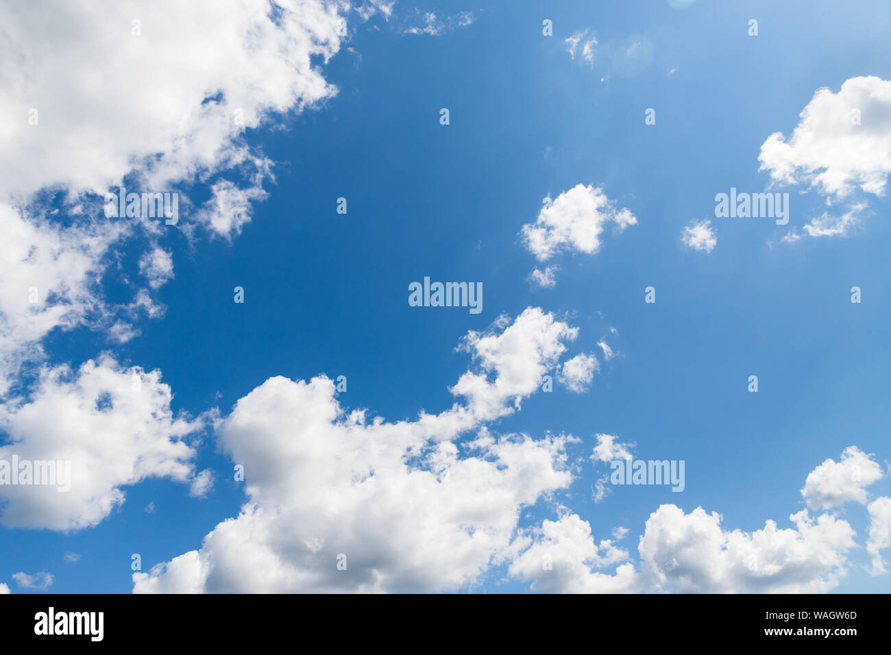 Beautiful white fluffy clouds on a deep blue sky background Stock Photo ...